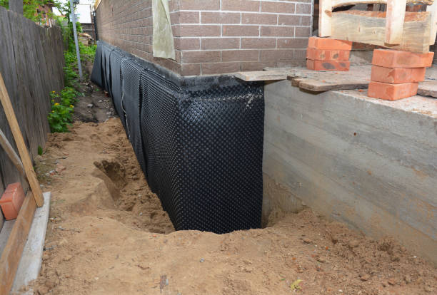 SJ Waterproofing Pros technician performing targeted Basement Waterproofing assessment in Willingboro, NJ